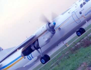 FX №60205 AN-26 plane on runway