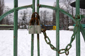 Castle mounted with chain on the gate of the park trolley №517