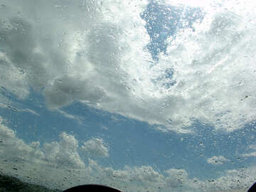 Low clouds through wet windscreen №635