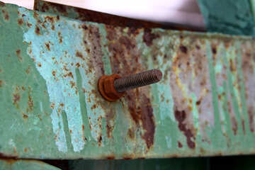 Rusty bolt with nut and washer on rusted painted metal №520