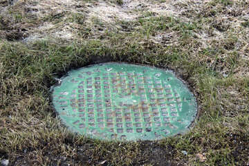 A manhole cover on the lawn №862