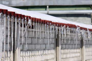 Icicles on the roof along the fence №486