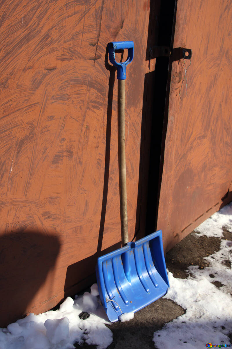Plastic shovel for cleaning on the background of the gate №692