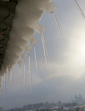 Icicles and snow on the roof №16616