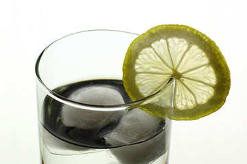 A glass of water with lemon
