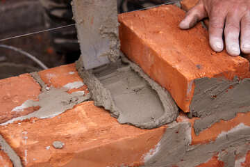  causing the bricks to cement 