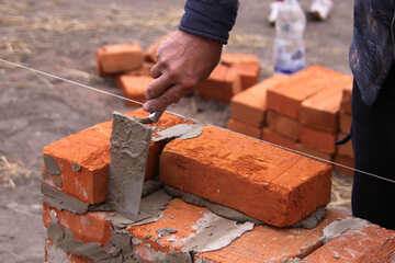 Man building brick wall №2935