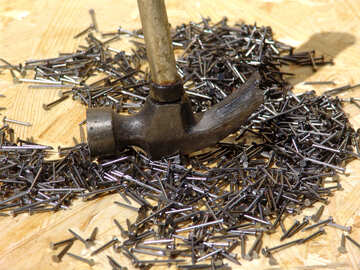  Hammer - nail puller and pile of nails  №2582