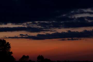 Orange sky with dark clouds at sunset №2400
