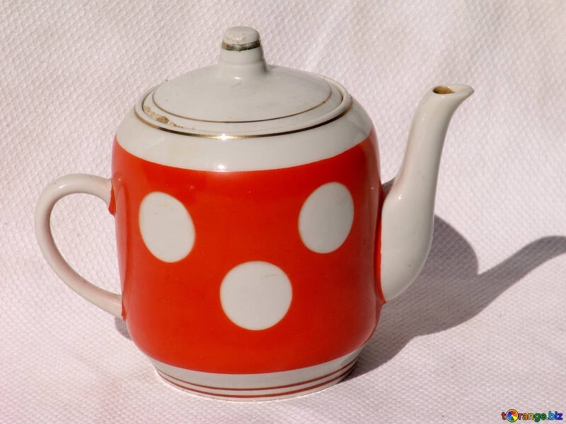 Old teapot in peas №2028