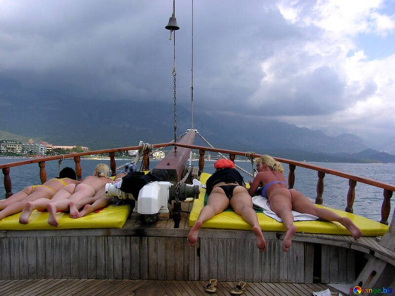 Girl sunbathing on the yacht bow №21959