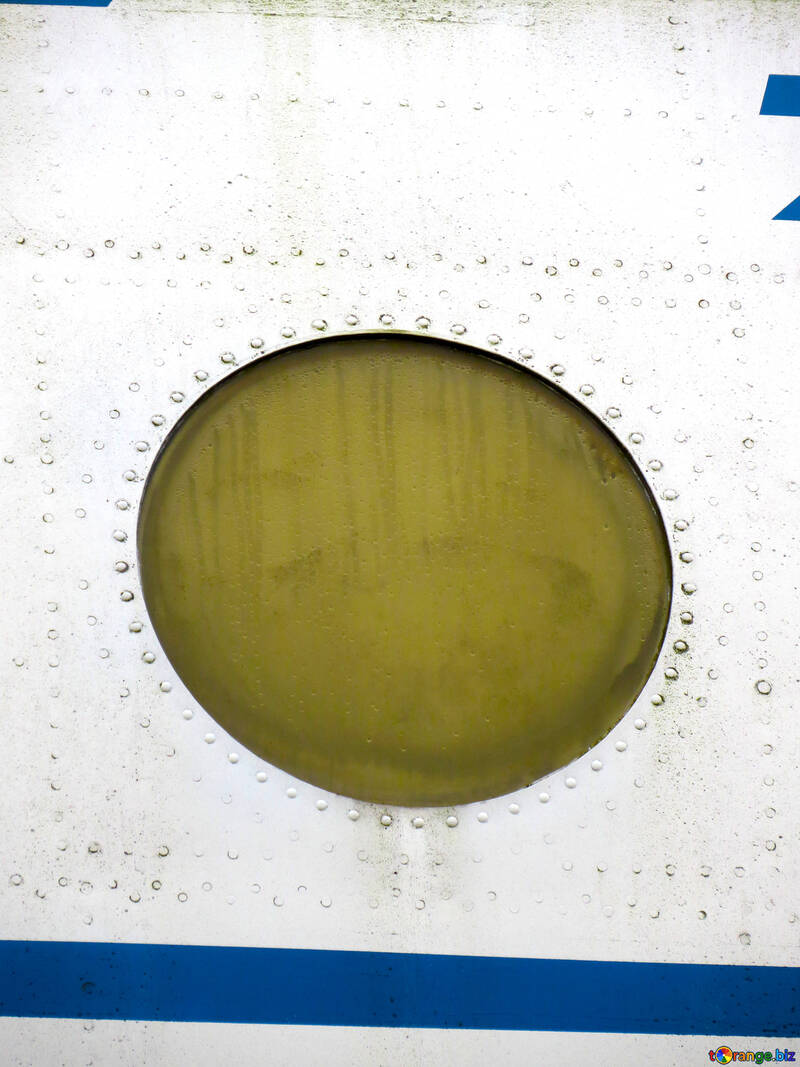 Textur der das runde Fenster im Flugzeug mit Nieten №26431
