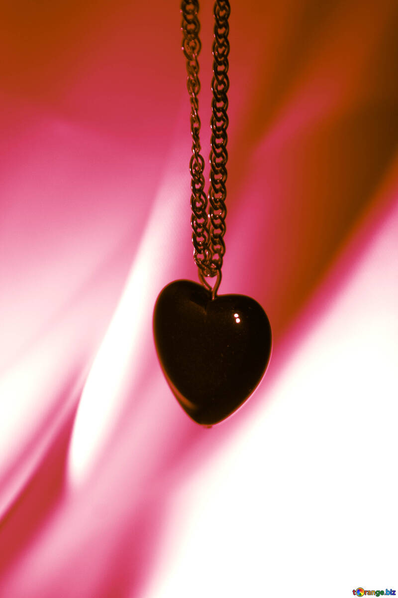 Heart black on gold chain on red background №3576