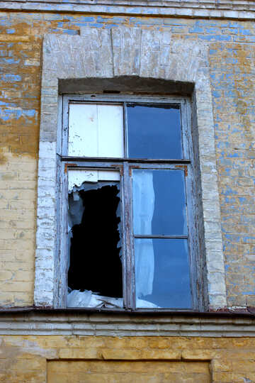 An old window with broken glass