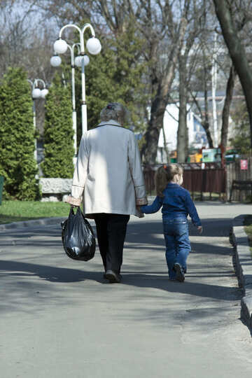 Grandmother and granddaughter walk in the park. №4533