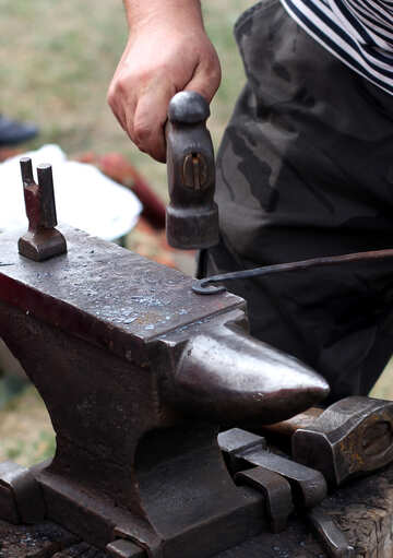 Blacksmith forges metal №42433