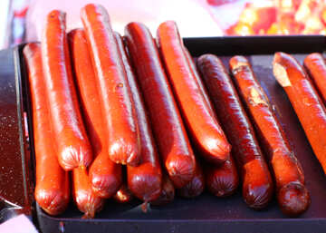 Smoked sausage for hot dog on the grill