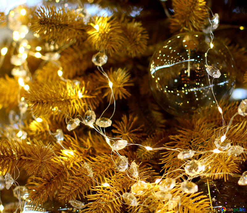 Transparent Christmas toy on a Christmas tree with bulbs №47767