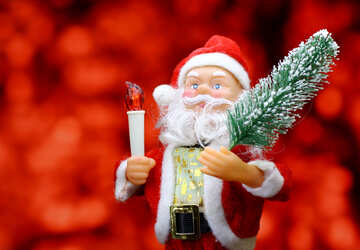 Nueva tarjeta con el juguete del `s de Santa Claus trae árbol de Navidad en el fondo del bokeh resplandor rojo. concepto contexto grande para la bandera mercado de Nueva Year`s, cartel, felicitaciones. №48166