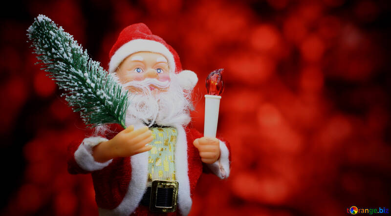 New Year`s card with Santa Claus toy brings Christmas tree at glow red bokeh background №48172