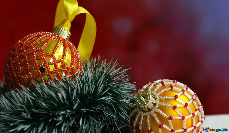 Christmas balls decorated with beads on a blurred background №48064