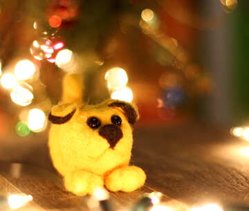 Symbol of new years 2018 yellow dog. New years greetings background. Fancy handmade toy from wool on bokeh Christmas background. Place for insert logo or write text. Copyspace for congratulations. №49605