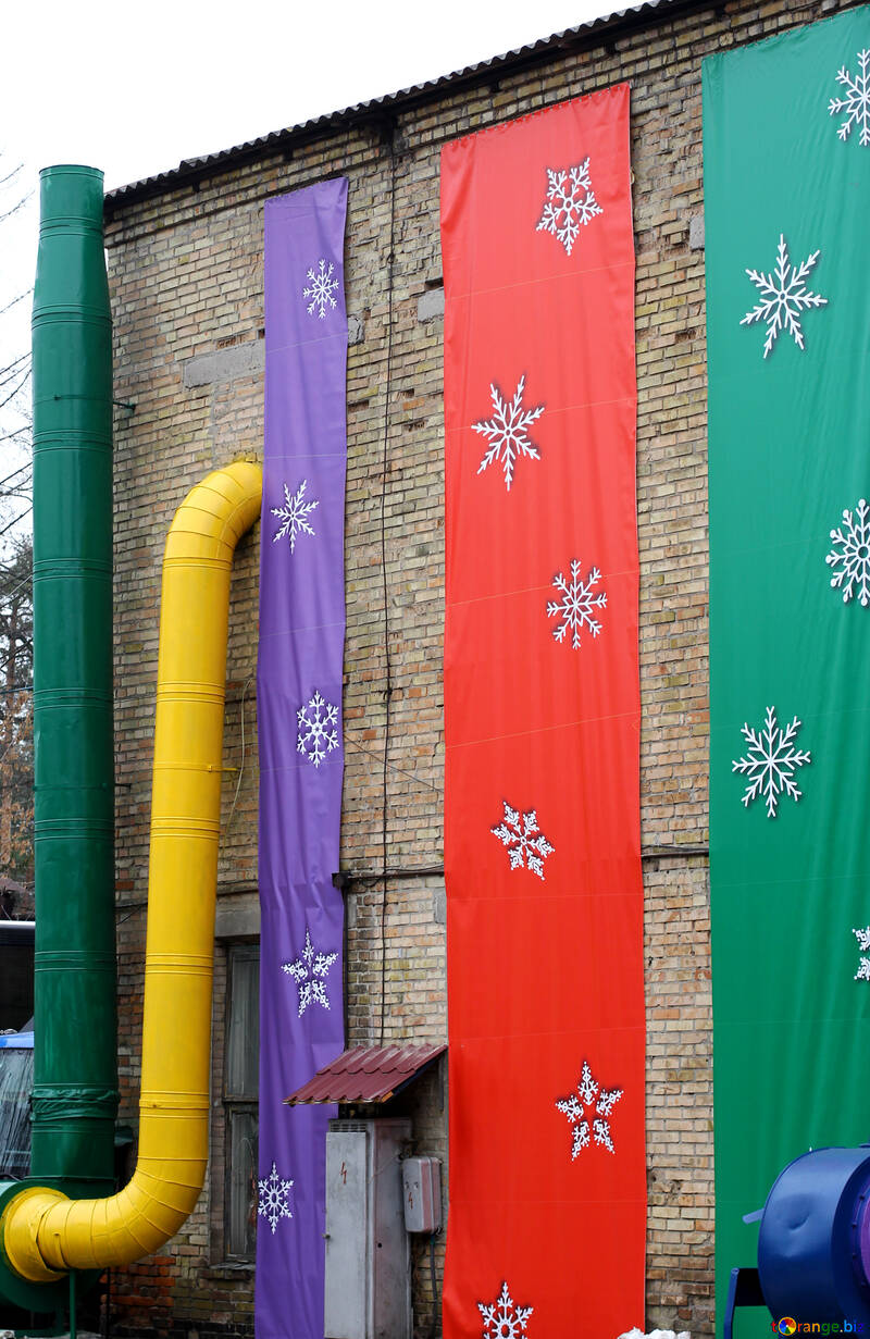 Yellow pipe and red green and purple cloth hanging №49433