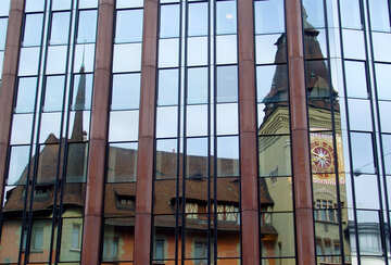 Reflection of the old tower with a clock №50120