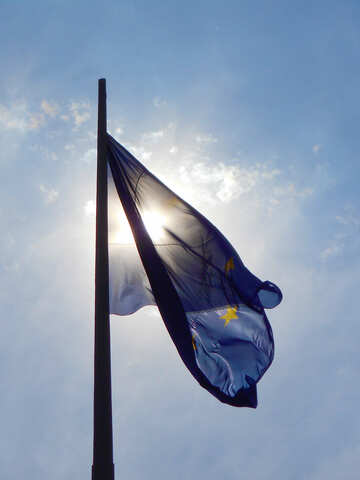 Blue flag in front of the sun №51287