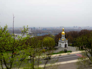 A church surrounded by trees cathedral buildings Road with city №52451