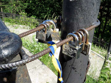 Locks locked to a piece of rebar that is wrapped around two posts №52090