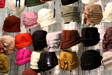 a bunch of what looks like hats on racks №52596