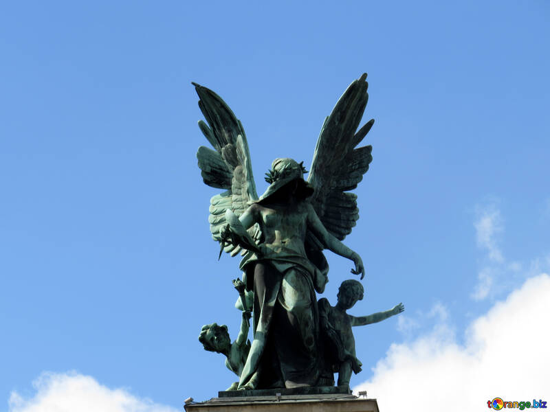 Statue of an an angel with sky in the background. №52266