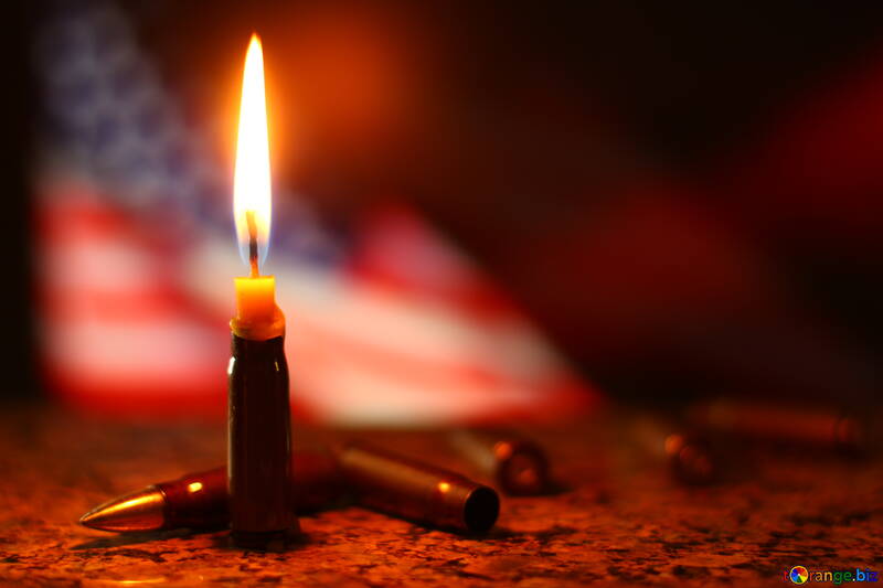 a lit candle with the American flag in the back №52517