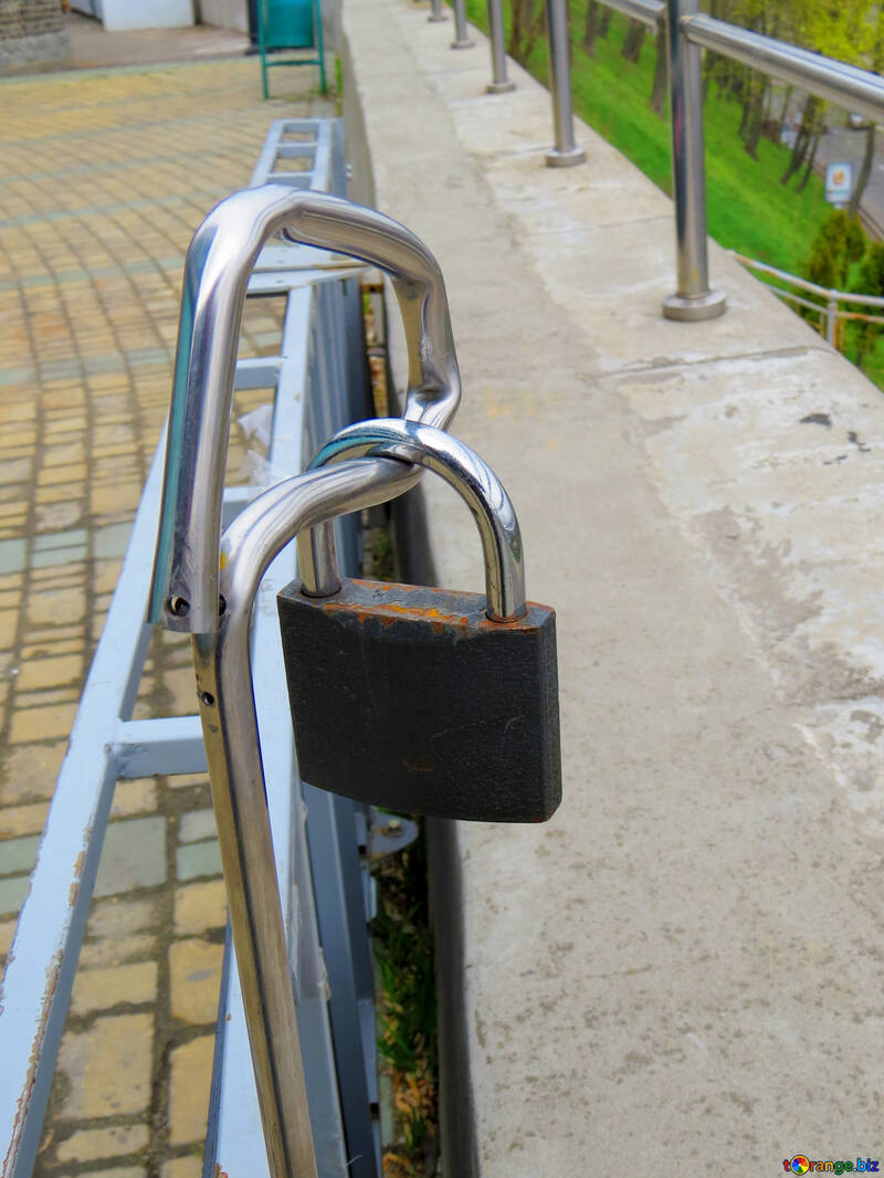 a lock on a hand rail Padlock railing with walkway №52429