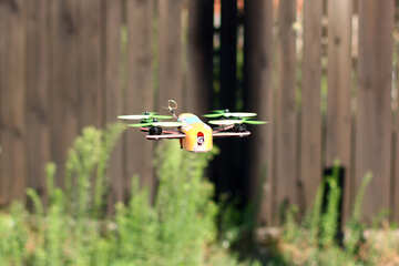 drone flying over hedges fence and grass №53675