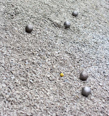 six balls that one of them is very small and  yellow ball  on sand ground №53983