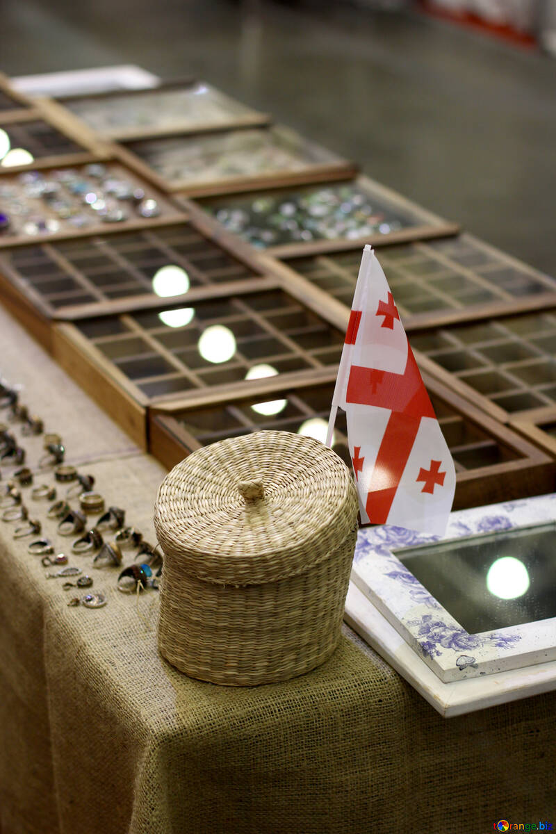 There is a flag near a basket and some display cases №53127