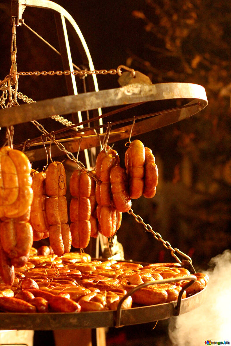 Sausages on a rack being cooked №53543