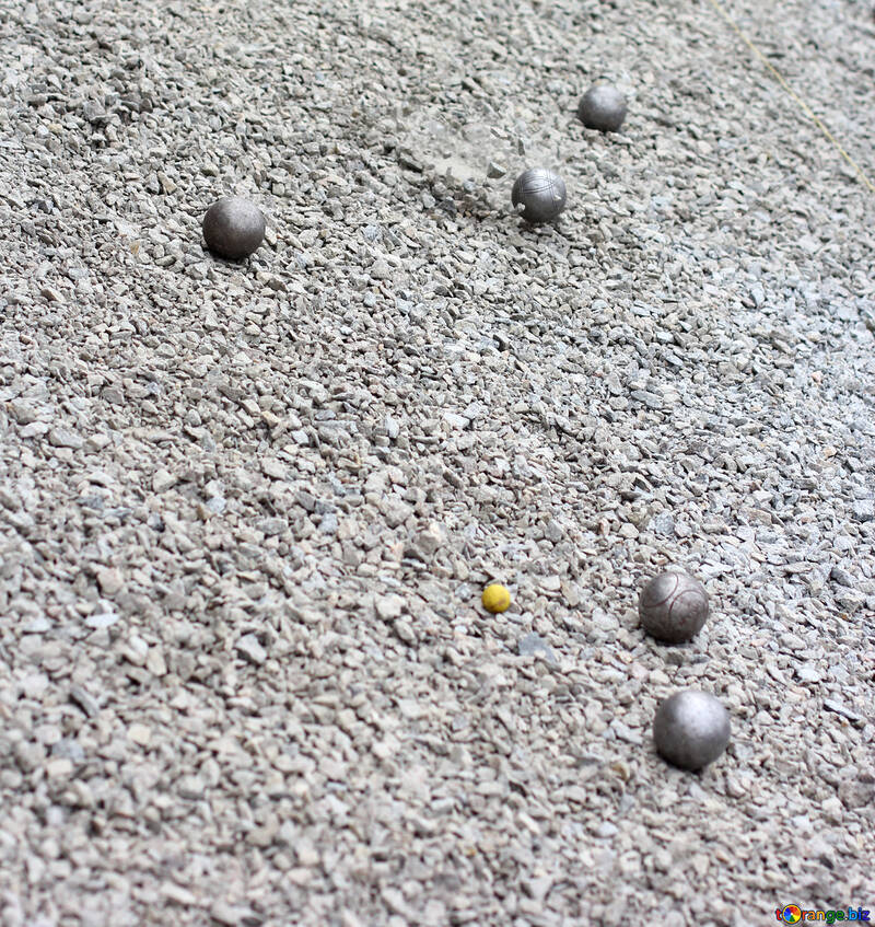six balls that one of them is very small and  yellow ball  on sand ground №53983