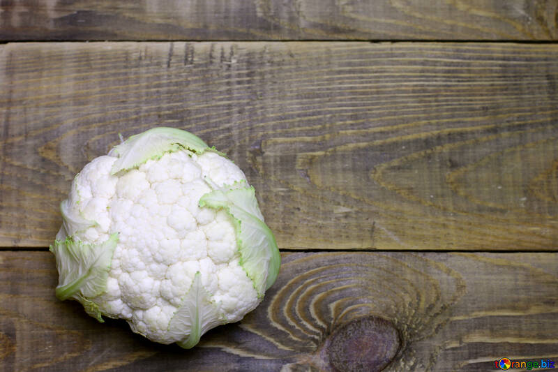 a head of cauliflower on wooden  table №53654