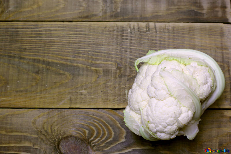 A table with a vegetable on it wood Cauliflower №53656