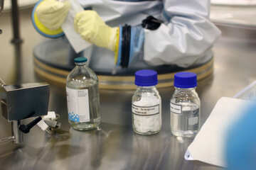 A few bottles of what looks like medicine  scientist medic gloves worker
