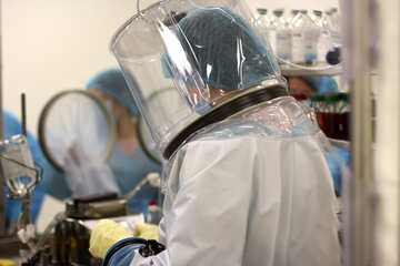 A scientist is working wearing a hazmat suit person using protection suit Lab scientist doctor mask №54589