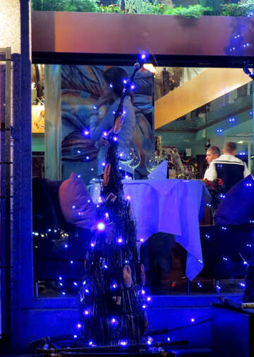 purple tree lights statue dancer people restaurant window sparkle background №54062