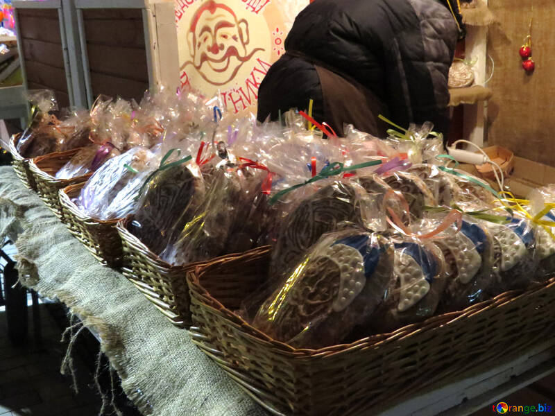 baskets of bread, a man cartoon face on the wall cookies Food for sale. №54123