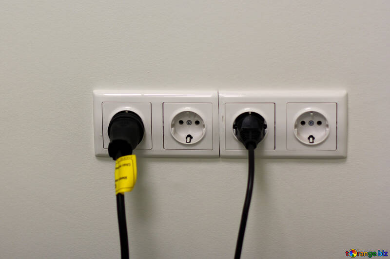 Cords plugged into sockets power outlet №54544
