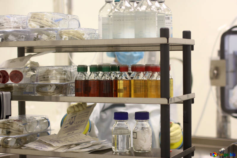 An open shelf with bottles of liquid and other supplies medicine  shelf bottles №54556