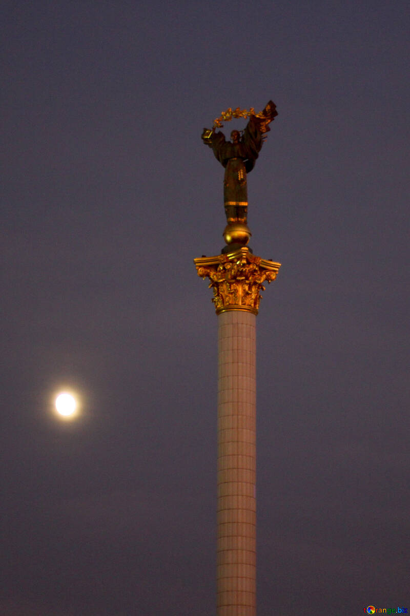 Monument with moon behind clouds №55099