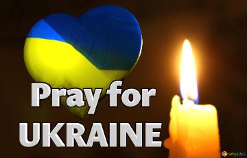 Pray For Ukraine Candle On Dark Background